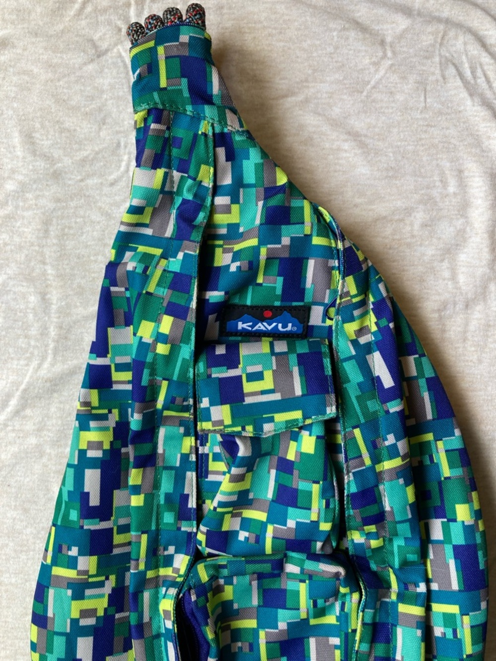 Kavu Geo-Print Sling Bag in Teal, Navy & Lime
